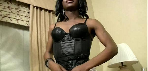  Black shemale in sexy leather corset shaking her massive ass